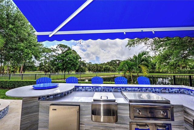 view of patio / terrace with a grill and an outdoor kitchen