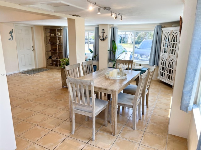 dining space with light tile patterned flooring