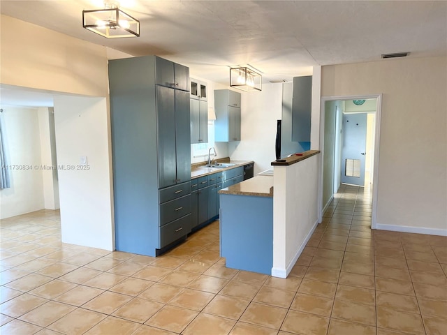 kitchen featuring sink and light tile patterned floors