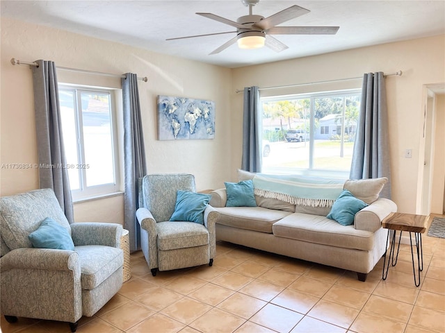 living room with light tile patterned floors and ceiling fan