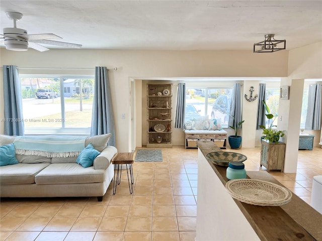 tiled living room with a healthy amount of sunlight