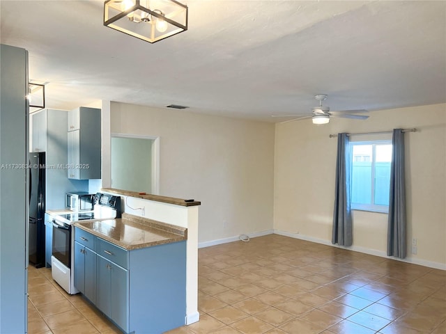 kitchen featuring blue cabinetry, ceiling fan, range with electric cooktop, light tile patterned flooring, and black fridge