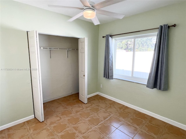 unfurnished bedroom with a closet and ceiling fan