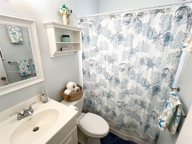 bathroom with vanity, toilet, and a shower with curtain