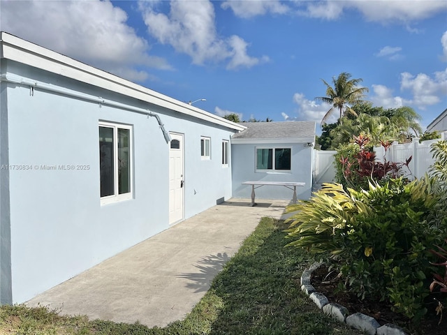 back of property with a patio