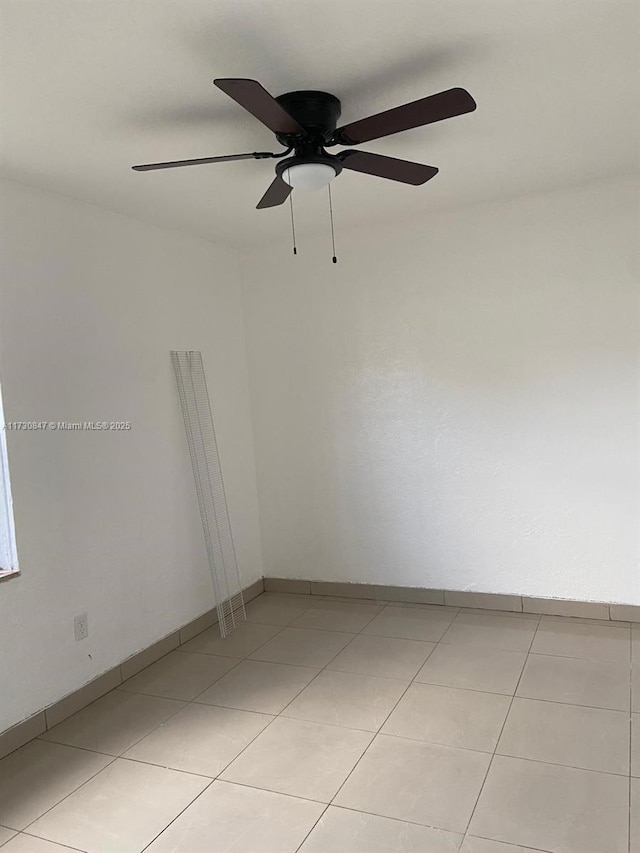 spare room featuring light tile patterned floors