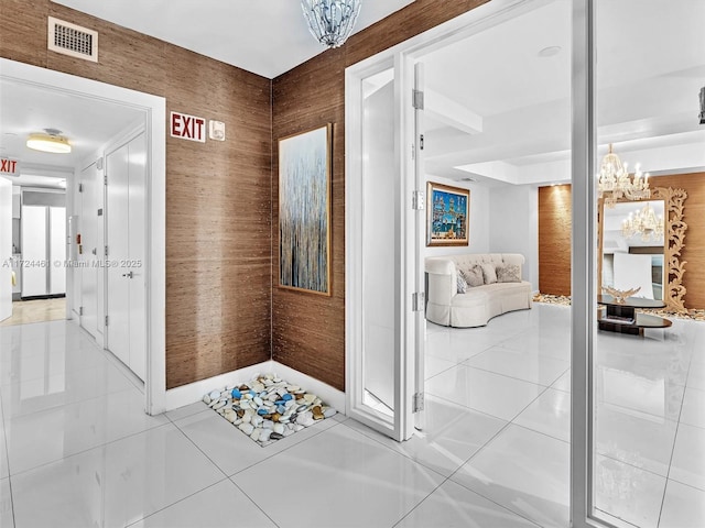 3201 NE 183rd St Unit 1207, Aventura, FL 33160 - hall with tile patterned floors and a chandelier