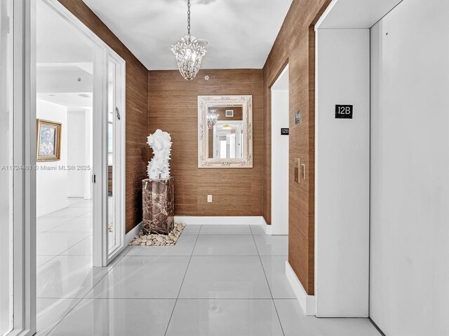 3201 NE 183rd St Unit 1207, Aventura, FL 33160 - hallway featuring elevator, a chandelier, and tile patterned flooring