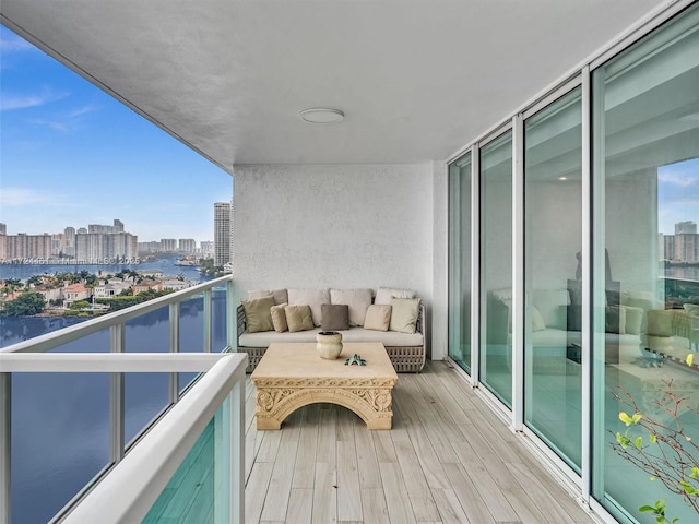 balcony featuring a water view