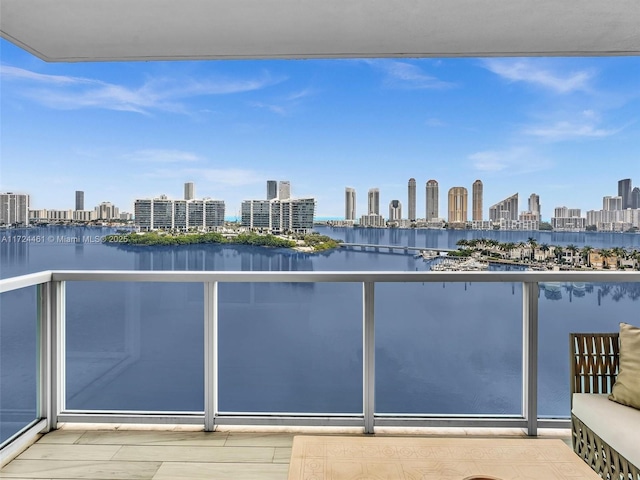 balcony featuring a water view