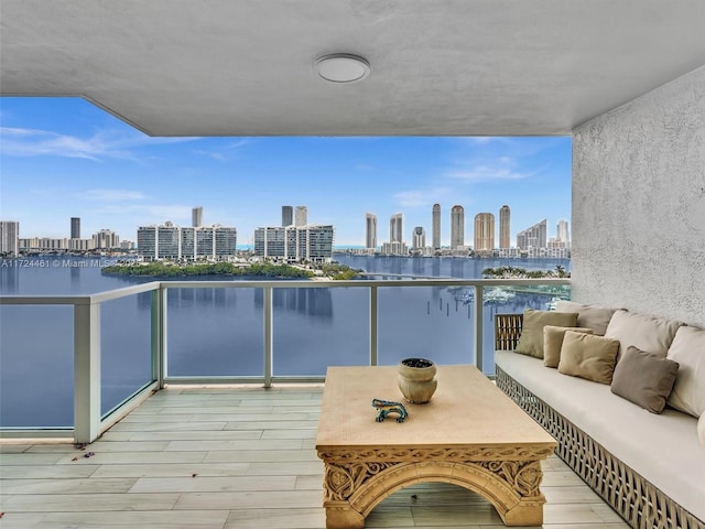 3201 NE 183rd St Unit 1207, Aventura, FL 33160 - balcony featuring a view of skyline, an outdoor hangout area, and a water view