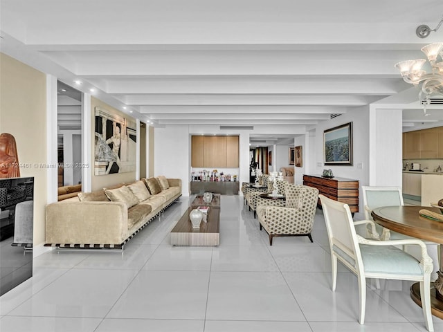 living room with a chandelier, tile patterned flooring, and beam ceiling