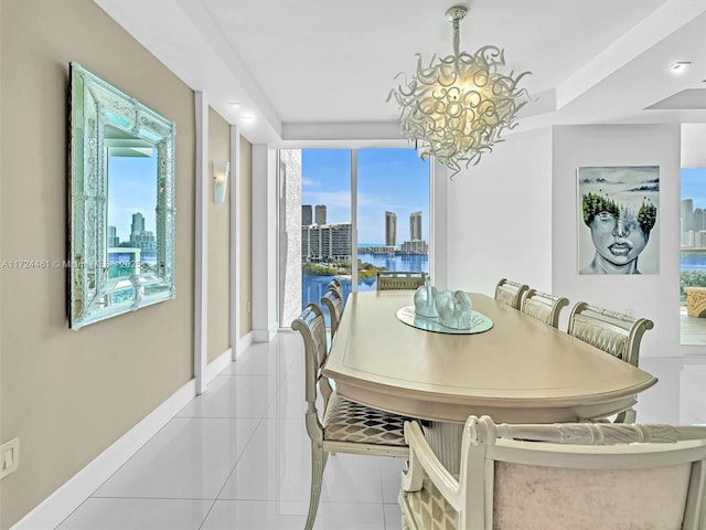 dining room with light tile patterned floors and a chandelier