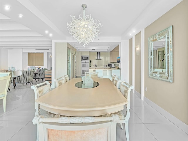 dining space featuring a chandelier and light tile patterned floors