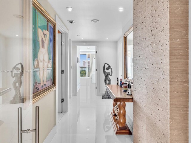 corridor featuring light tile patterned floors