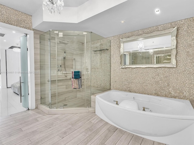 bathroom with shower with separate bathtub