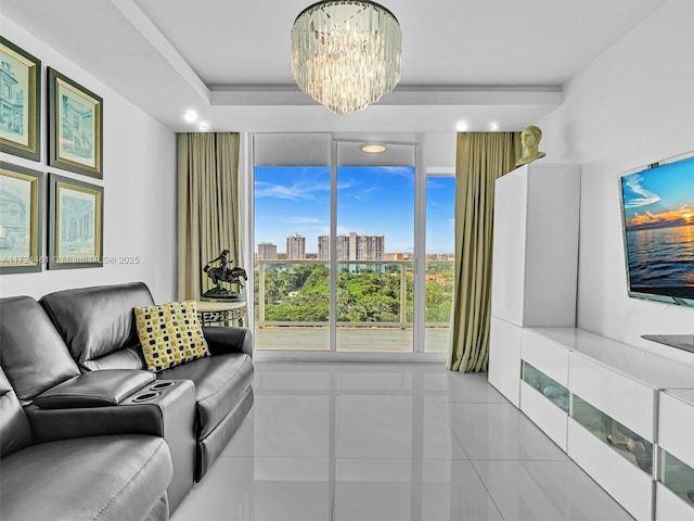 living room with light tile patterned floors and a notable chandelier