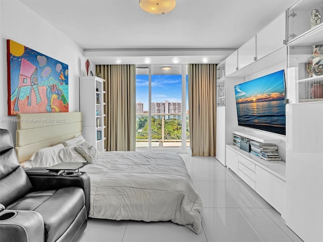 bedroom with light tile patterned floors