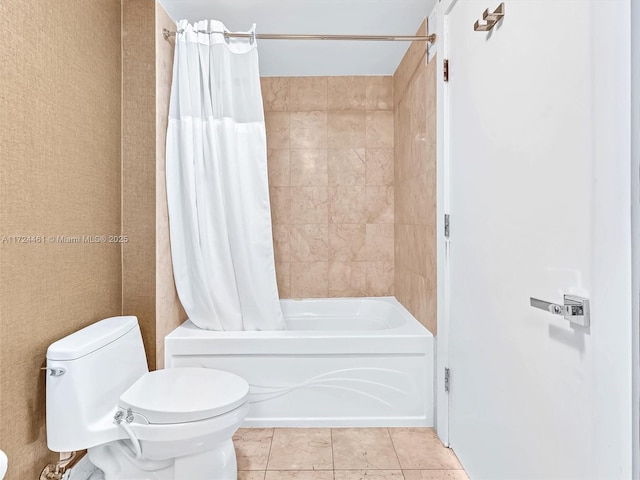 bathroom featuring toilet, shower / tub combo, and tile patterned floors