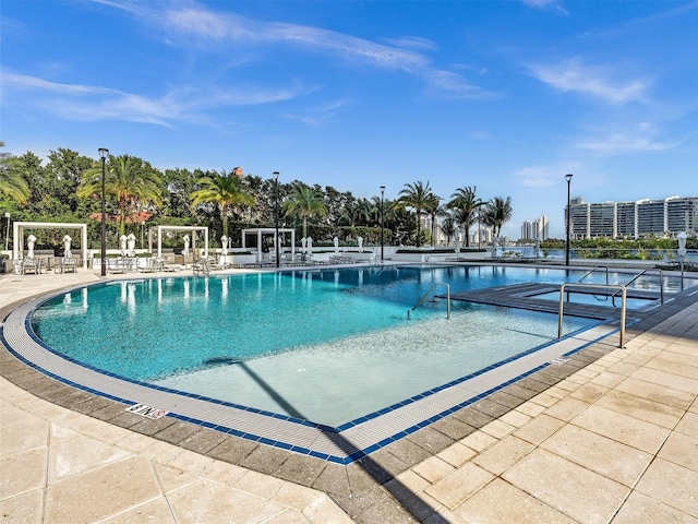 view of swimming pool featuring a patio