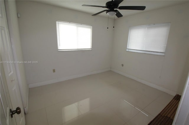 tiled empty room with ceiling fan