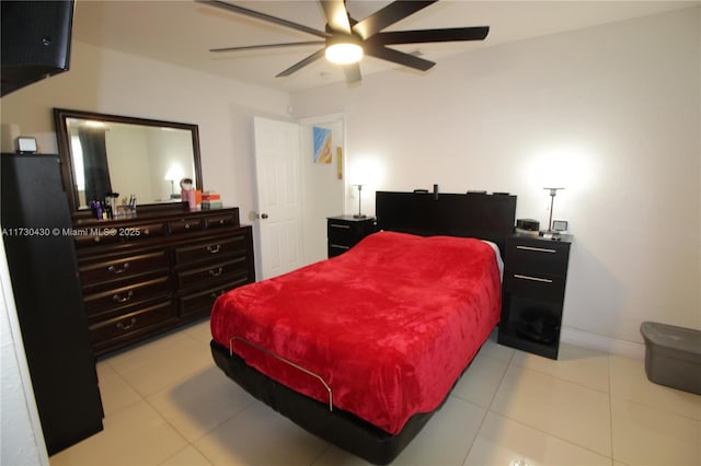 bedroom with ceiling fan and light tile patterned flooring