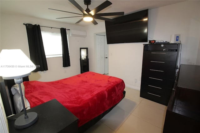 bedroom with a wall mounted AC, ceiling fan, and light tile patterned floors