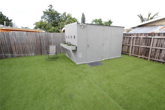 view of outdoor structure featuring a lawn