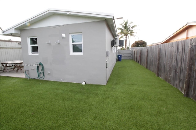 rear view of house featuring a yard