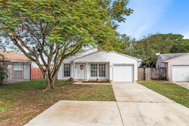 view of front facade featuring a garage and a front yard