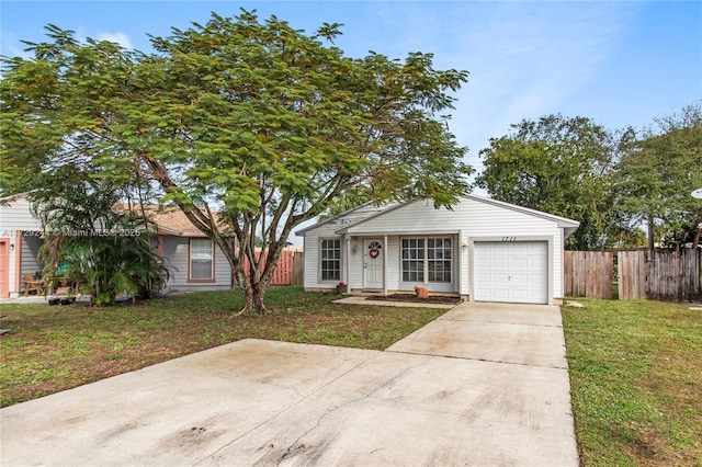 view of front of house featuring a garage and a front yard