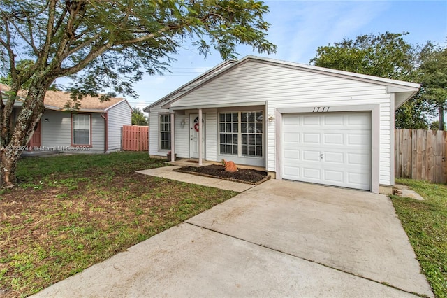 view of front of house with a garage and a front lawn