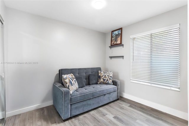 sitting room featuring hardwood / wood-style flooring