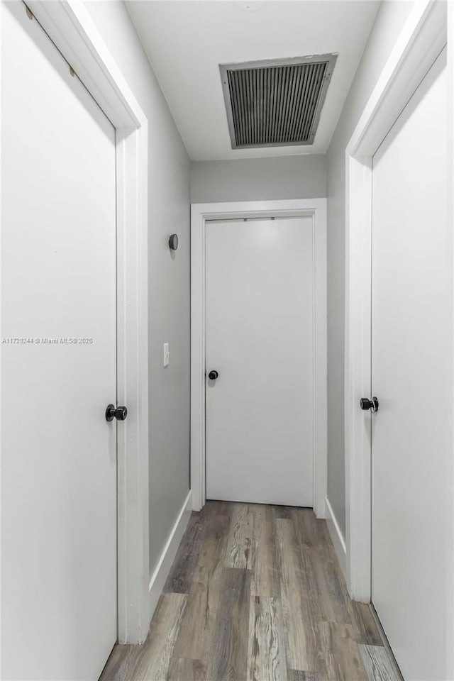 corridor featuring light hardwood / wood-style flooring