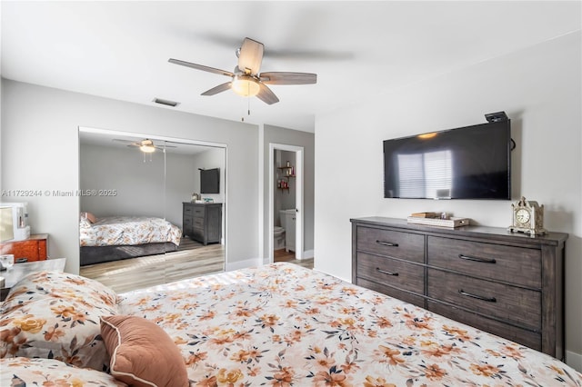 bedroom featuring ceiling fan, connected bathroom, and a closet