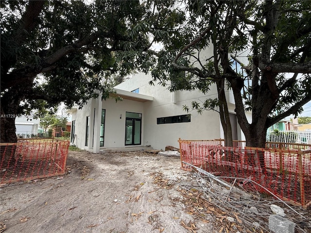 2606 SW 19th St, Miami, FL 33145 - back of property with stucco siding and fence