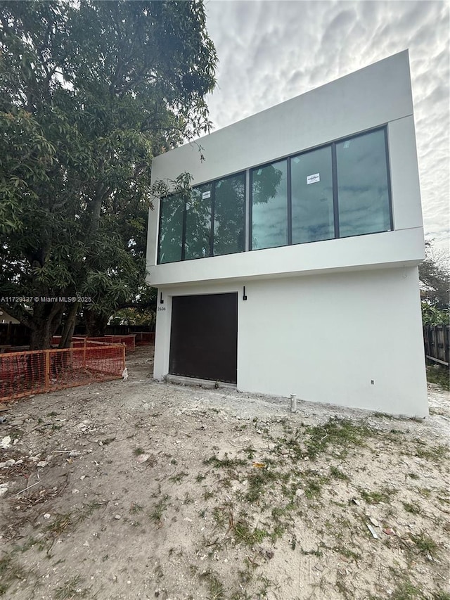 2606 SW 19th St, Miami, FL 33145 - exterior space with fence, a garage, and stucco siding