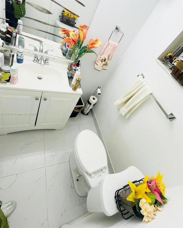1401 NE 191st St Unit D112, Miami, FL 33179 - bathroom with toilet, marble finish floor, and vanity