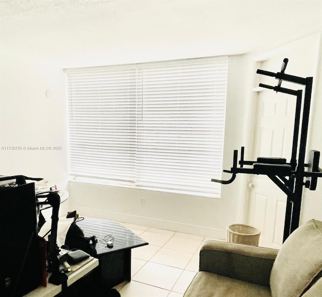 1401 NE 191st St Unit D112, Miami, FL 33179 - workout area with tile patterned floors and baseboards