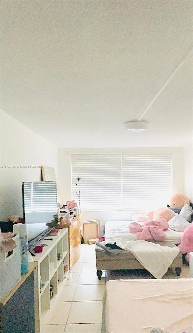 1401 NE 191st St Unit D112, Miami, FL 33179 - bedroom with light tile patterned floors