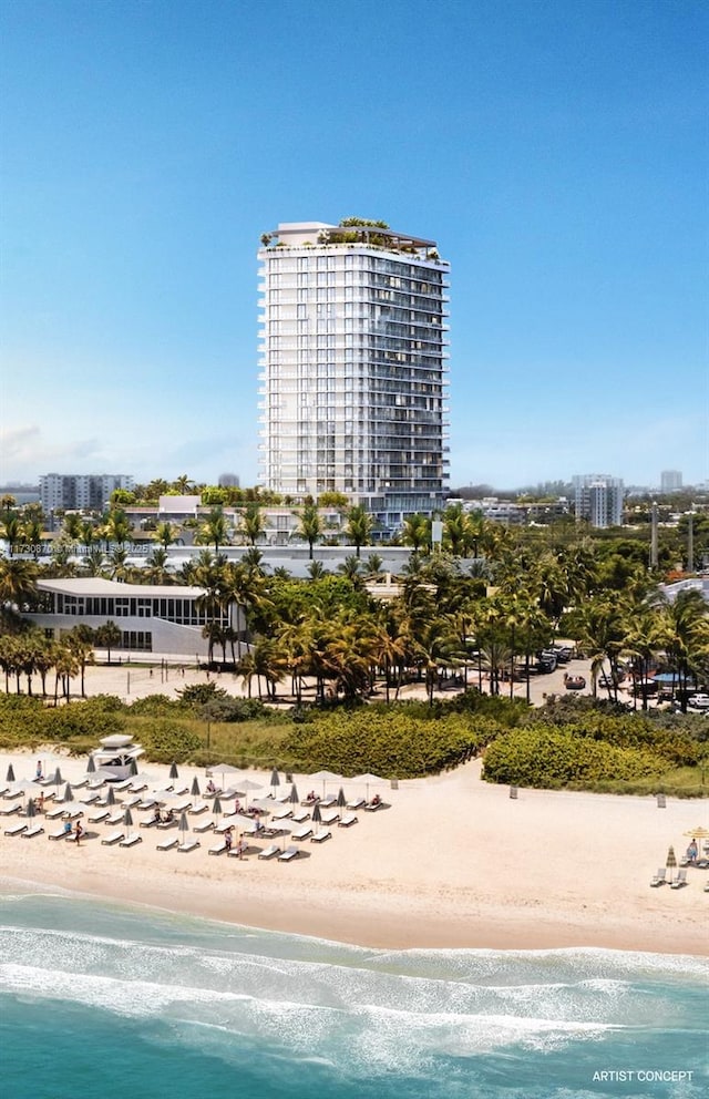 exterior space featuring a water view and a view of the beach