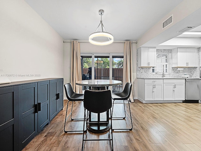 dining room with light hardwood / wood-style floors