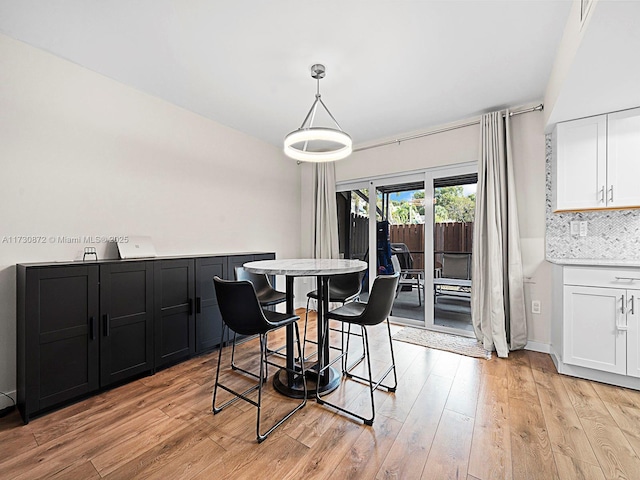 dining space featuring light wood-type flooring