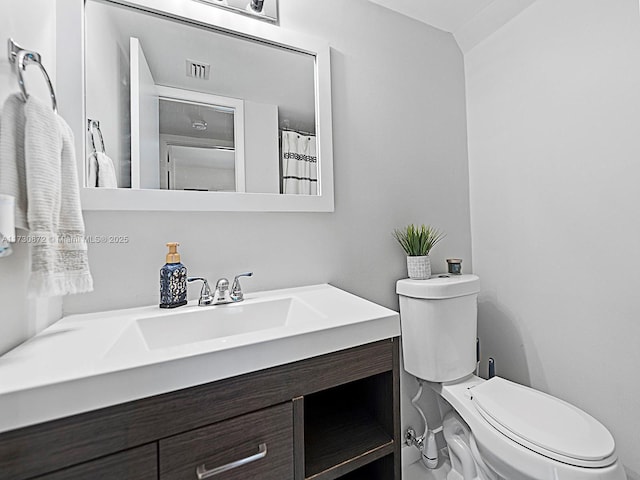 bathroom with vanity and toilet