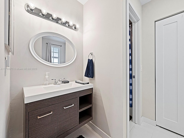 bathroom with vanity and tile patterned floors