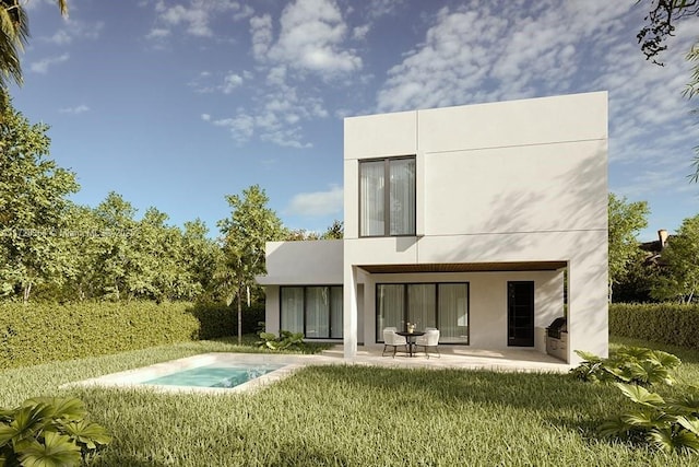 rear view of property featuring a lawn and a patio