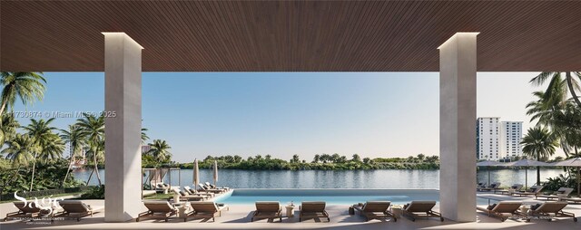 interior space featuring light hardwood / wood-style flooring, ceiling fan, sink, a water view, and a wall of windows