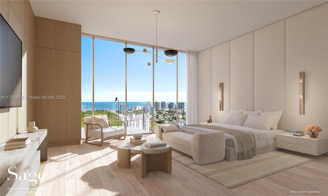 bedroom with a wall of windows, a water view, and light wood-type flooring