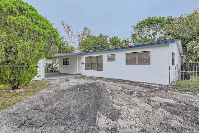 view of front of house featuring a carport