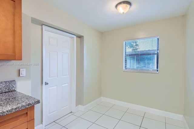 interior space featuring light tile patterned floors